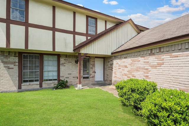 4027 Brookhead Trl, Houston, TX 77066 - property entrance featuring a lawn, stucco siding, and brick siding