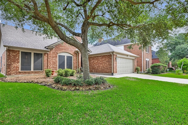 ranch-style house featuring a garage, a shingled roof, and brick siding