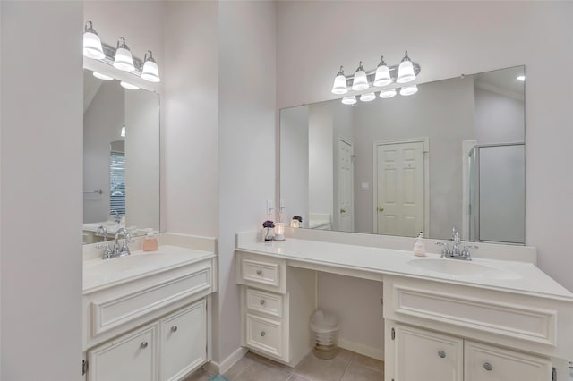 full bathroom with tile patterned flooring, a sink, a stall shower, and two vanities