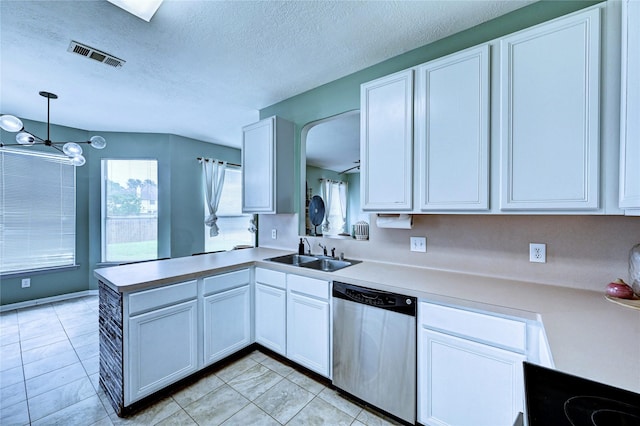 kitchen with visible vents, a sink, dishwasher, and white cabinets