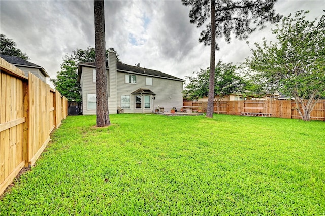 view of yard with a fenced backyard