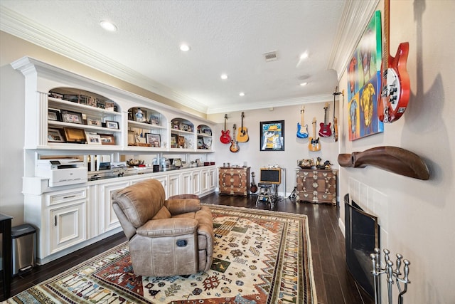 1623 Scenic Shore Dr, Kingwood, TX 77345 - sitting room featuring crown molding, recessed lighting, a textured ceiling, and dark wood-type flooring