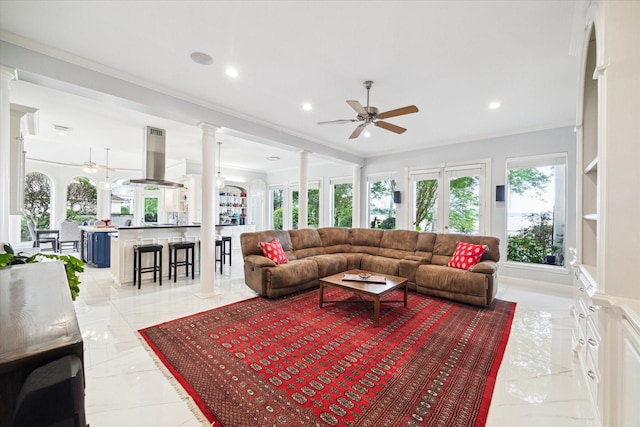 1623 Scenic Shore Dr, Kingwood, TX 77345 - living area featuring ornate columns, crown molding, ceiling fan, and recessed lighting