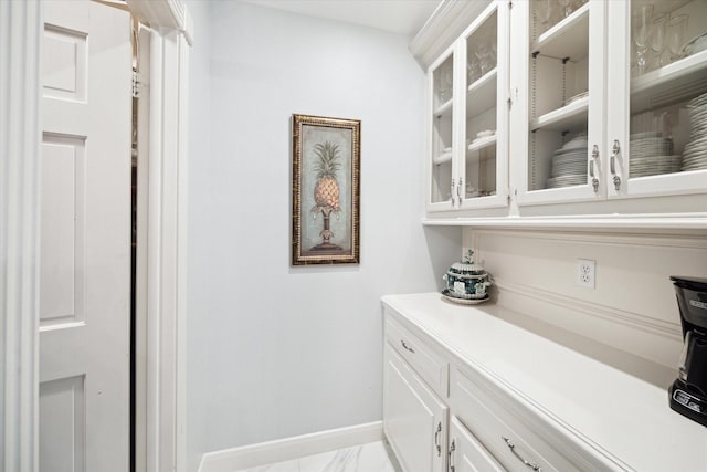 1623 Scenic Shore Dr, Kingwood, TX 77345 - bar with baseboards and marble finish floor
