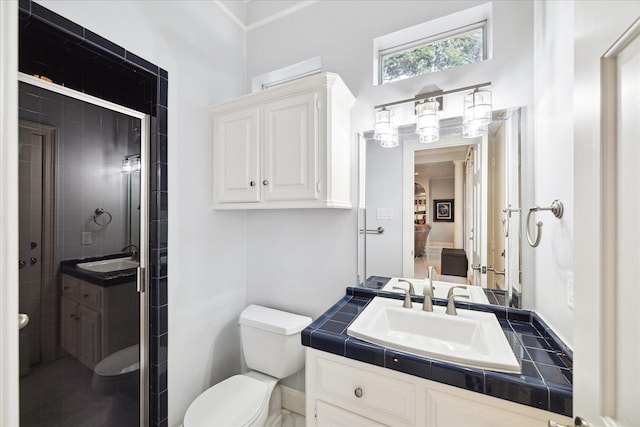 1623 Scenic Shore Dr, Kingwood, TX 77345 - ensuite bathroom featuring vanity, ensuite bathroom, a shower stall, and toilet