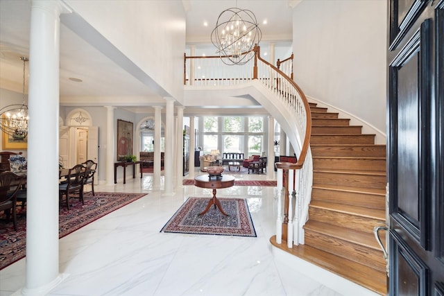 1623 Scenic Shore Dr, Kingwood, TX 77345 - entrance foyer with crown molding, marble finish floor, a high ceiling, and stairway