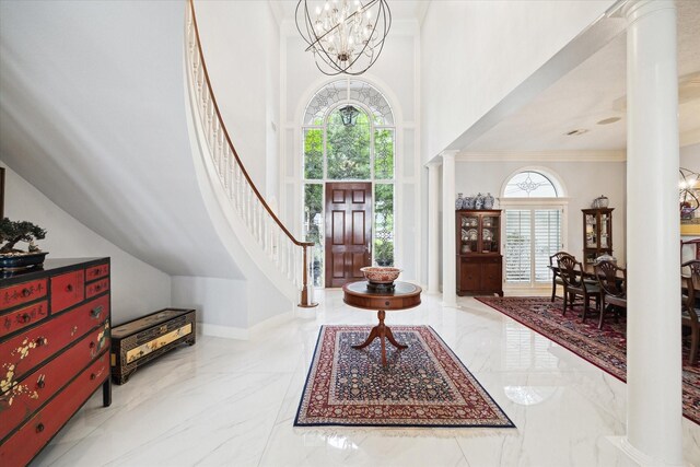 1623 Scenic Shore Dr, Kingwood, TX 77345 - foyer entrance featuring a towering ceiling, marble finish floor, an inviting chandelier, ornamental molding, and stairs