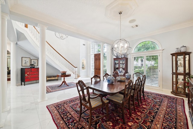 1623 Scenic Shore Dr, Kingwood, TX 77345 - dining room with visible vents, crown molding, marble finish floor, stairs, and ornate columns