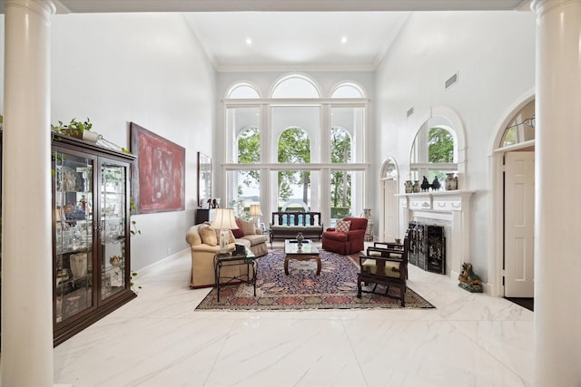 1623 Scenic Shore Dr, Kingwood, TX 77345 - living room with marble finish floor, a high ceiling, decorative columns, and visible vents