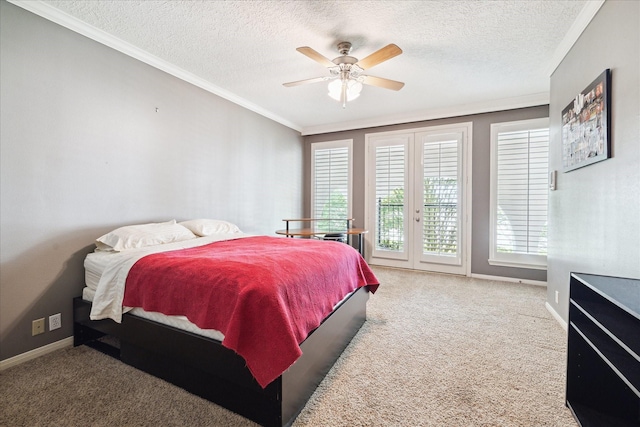 1623 Scenic Shore Dr, Kingwood, TX 77345 - carpeted bedroom featuring access to outside, a textured ceiling, multiple windows, and ornamental molding