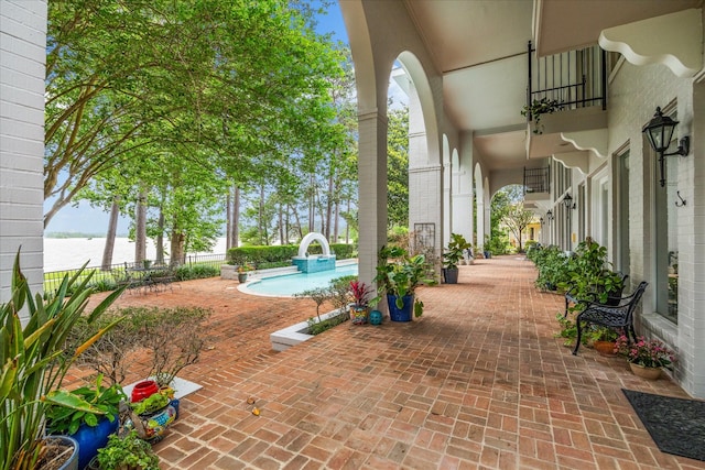 1623 Scenic Shore Dr, Kingwood, TX 77345 - view of patio / terrace featuring a fenced in pool, a water view, and fence