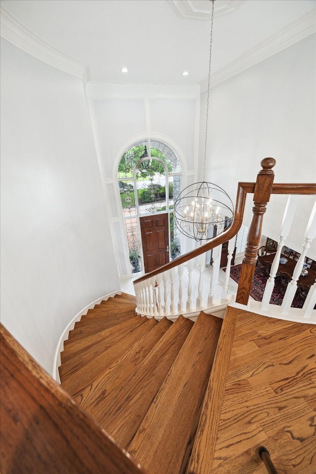 1623 Scenic Shore Dr, Kingwood, TX 77345 - staircase featuring recessed lighting, a notable chandelier, and ornamental molding