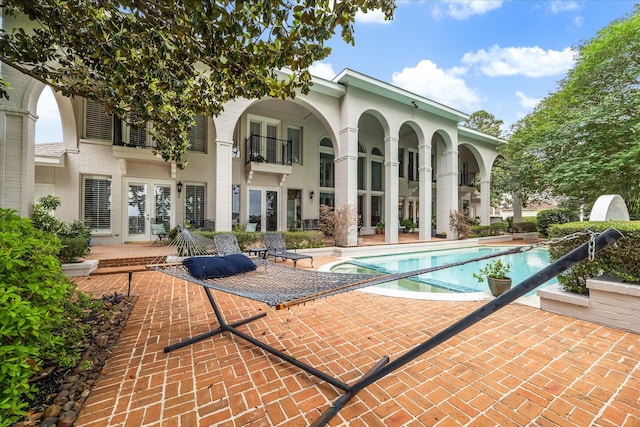 1623 Scenic Shore Dr, Kingwood, TX 77345 - exterior space with a patio area and french doors