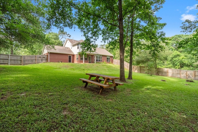view of yard with a fenced backyard