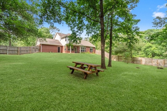 view of yard with a fenced backyard