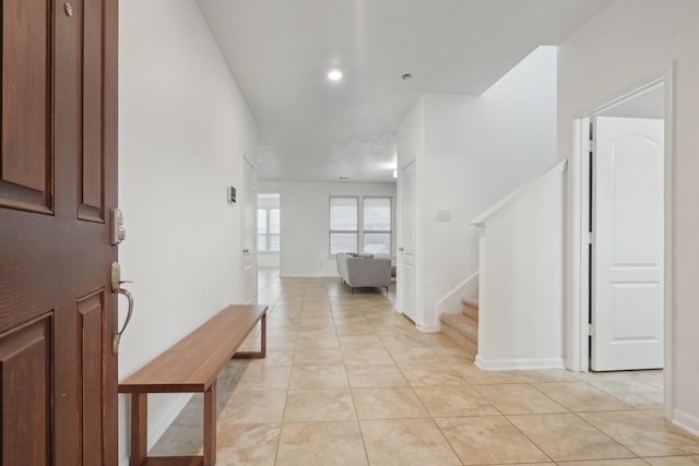 25404 Devonshire Knoll St, Katy, TX 77493 - entrance foyer featuring stairway, light tile patterned floors, and baseboards