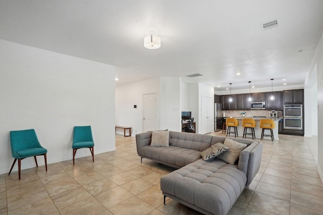 25404 Devonshire Knoll St, Katy, TX 77493 - living room featuring recessed lighting, visible vents, and light tile patterned floors
