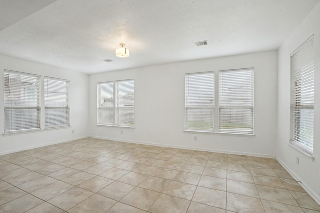 25404 Devonshire Knoll St, Katy, TX 77493 - unfurnished room with light tile patterned floors, baseboards, and visible vents