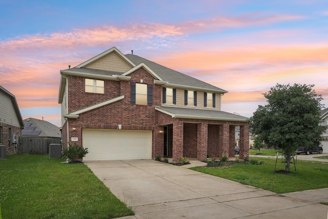 25404 Devonshire Knoll St, Katy, TX 77493 - traditional home featuring a lawn, driveway, brick siding, and a garage