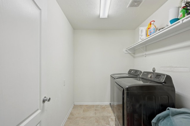 25404 Devonshire Knoll St, Katy, TX 77493 - laundry area featuring laundry area, a textured ceiling, visible vents, baseboards, and washer and dryer