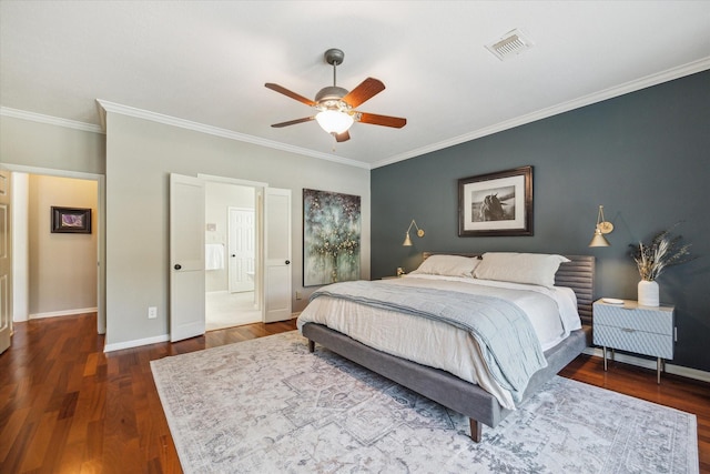 bedroom with crown molding, ceiling fan, baseboards, wood finished floors, and visible vents