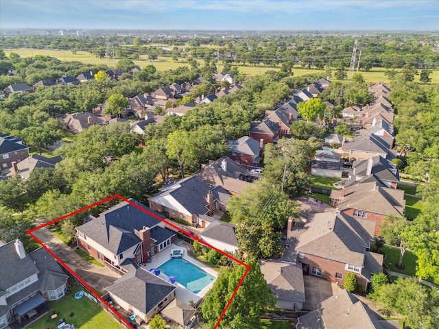 birds eye view of property with a residential view