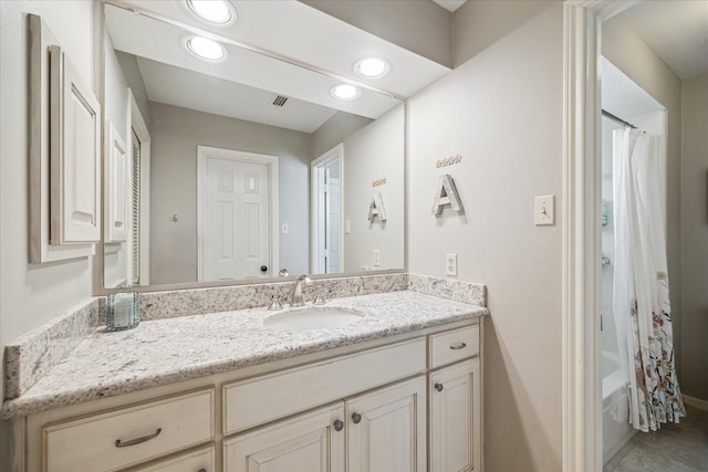 full bath featuring vanity, recessed lighting, and shower / bath combination with curtain