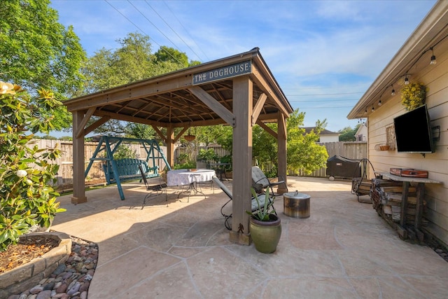 view of patio with a gazebo and a fenced backyard