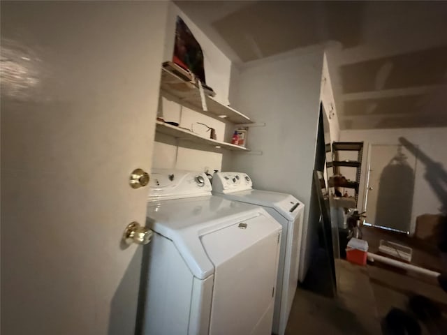 laundry area featuring laundry area and independent washer and dryer