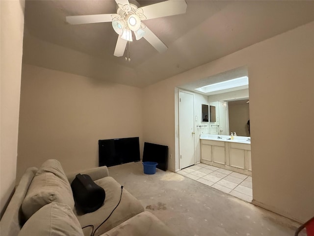 living area featuring a ceiling fan