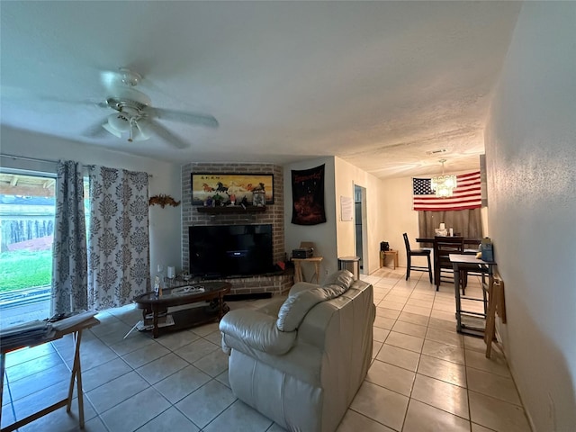 living area with light tile patterned floors and ceiling fan with notable chandelier