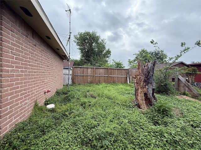 view of yard featuring fence