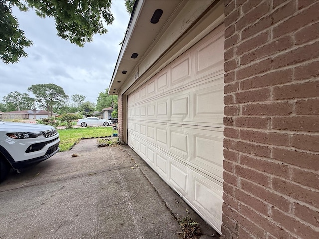 garage with aphalt driveway