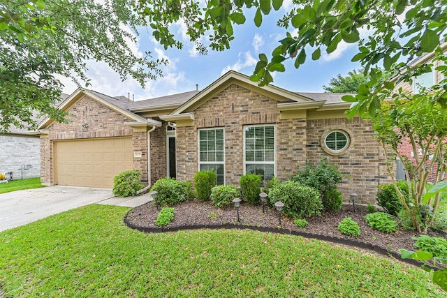 ranch-style house with an attached garage, driveway, brick siding, and a front yard