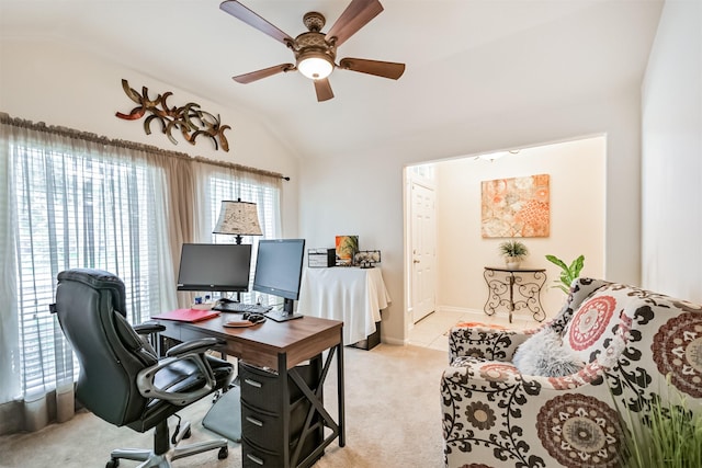 office with ceiling fan, vaulted ceiling, light carpet, and baseboards