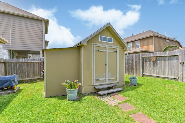view of shed with a fenced backyard