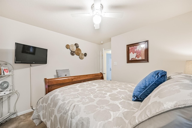 bedroom with a ceiling fan, baseboards, and carpet