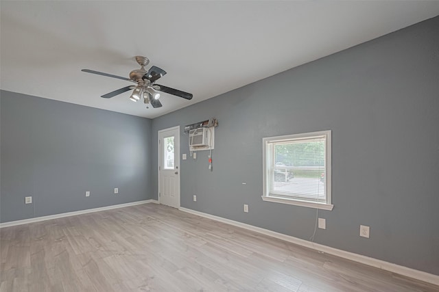 unfurnished room with light wood-style floors, baseboards, and ceiling fan