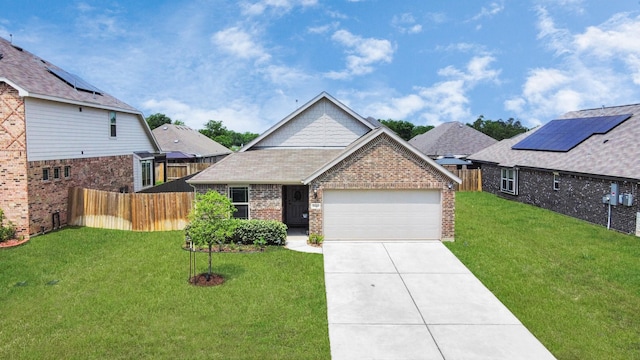 craftsman house with brick siding, a garage, fence, and a front yard