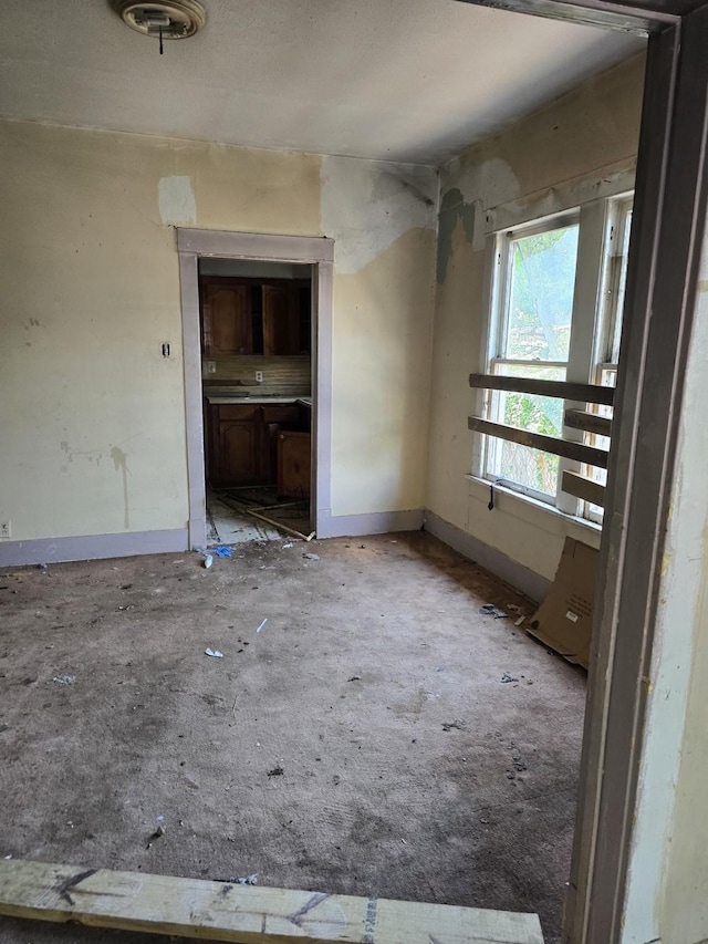 empty room with baseboards