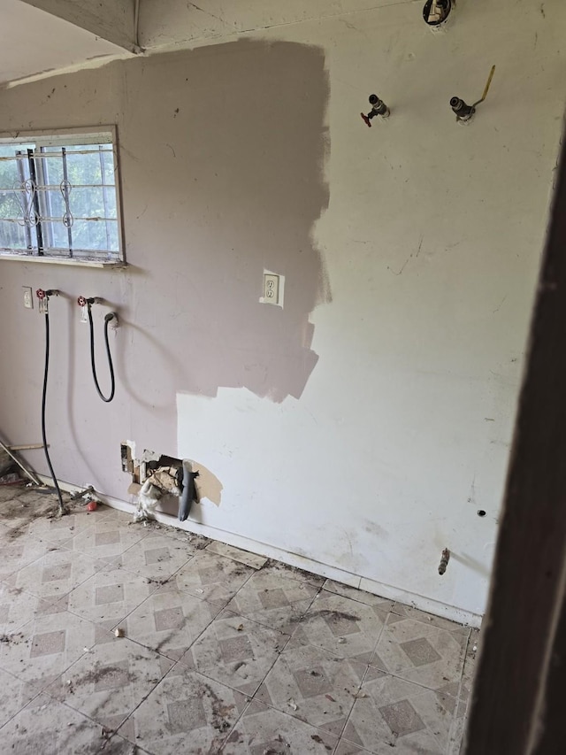 laundry room featuring tile patterned floors