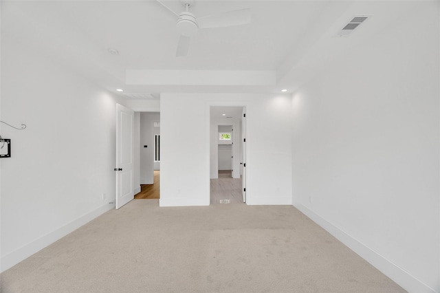unfurnished room featuring ceiling fan, light colored carpet, recessed lighting, baseboards, and visible vents