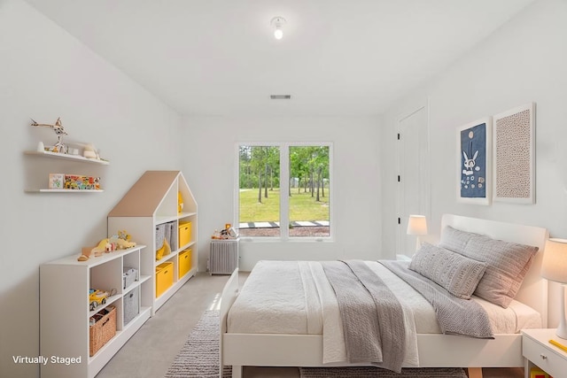 bedroom featuring visible vents