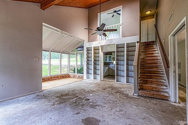 unfurnished living room with visible vents, ceiling fan, stairway, wooden ceiling, and vaulted ceiling