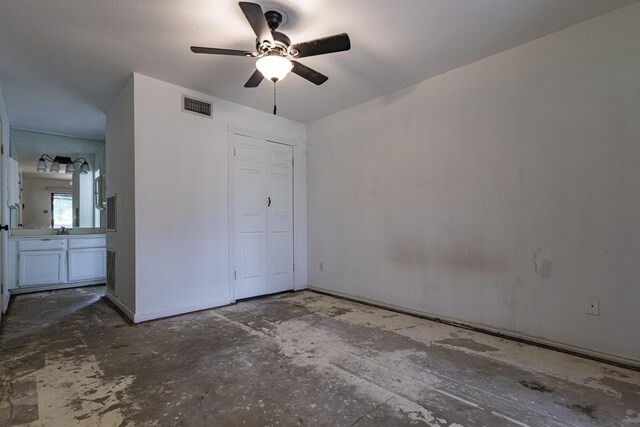 unfurnished bedroom featuring baseboards, ceiling fan, and visible vents