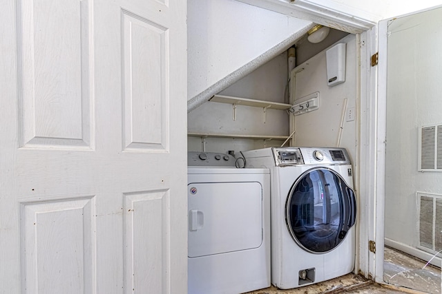 laundry room featuring laundry area, independent washer and dryer, and visible vents