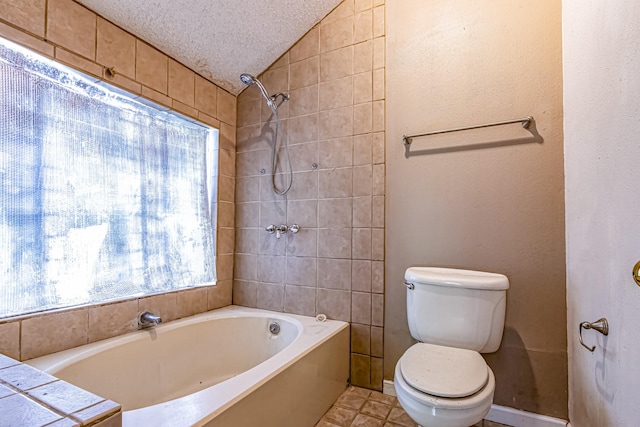 full bathroom featuring a textured ceiling, vaulted ceiling, and toilet