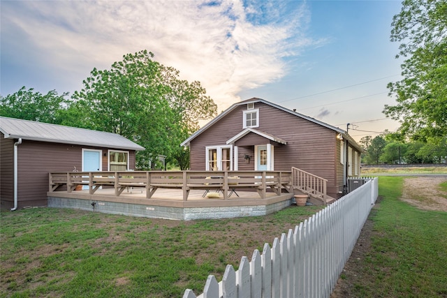 303 S Mechanic St, Fayetteville, TX 78940 - rear view of house featuring fence, a yard, and a deck