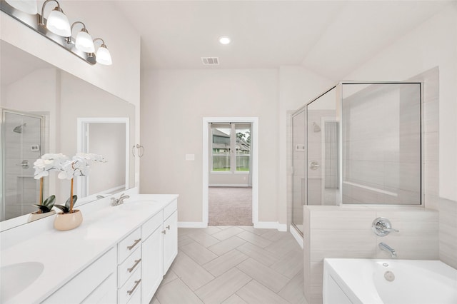 bathroom with baseboards, visible vents, a shower stall, and a sink