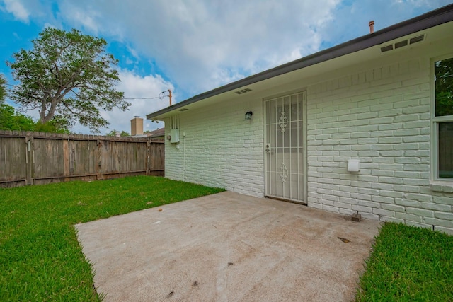 view of patio featuring fence